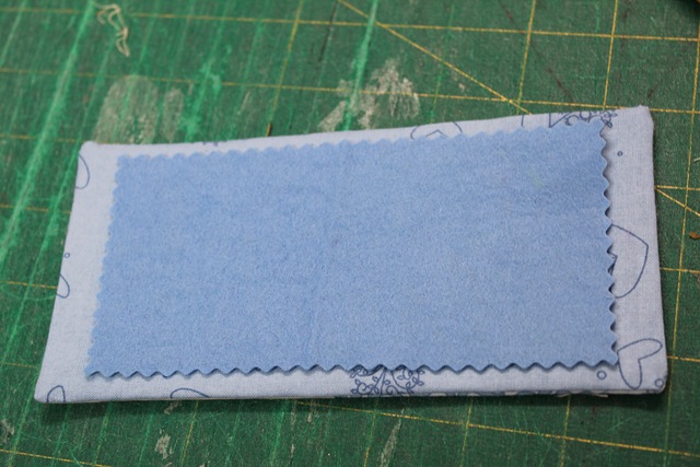 two pieces of overlapping rectangle fabrics - from A Quick and Simple Needlebook Tutorial by Helen of Hugs 'n Kisses