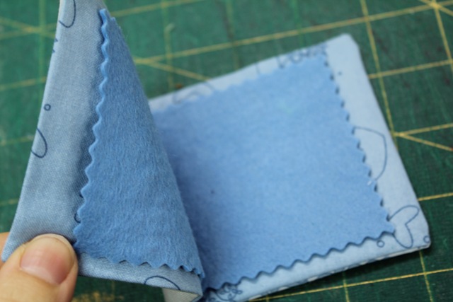 folded and pressed pieces of fabrics - from A Quick and Simple Needlebook Tutorial by Helen of Hugs 'n Kisses